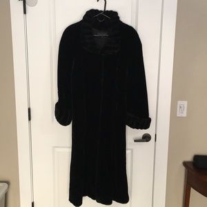 Black faux fur full length coat. Slightly worn